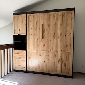 A room with a large wardrobe, a small cabinet, and a shelf unit. - Mountain Views - Third floor 2 bdrm loft condo in Frisco, walk to town! (Breckenridge)