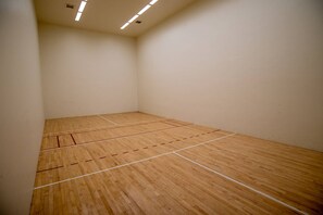 A squash court with a wooden floor and white walls. - Mountain Views - Third floor 2 bdrm loft condo in Frisco, walk to town! (Breckenridge)