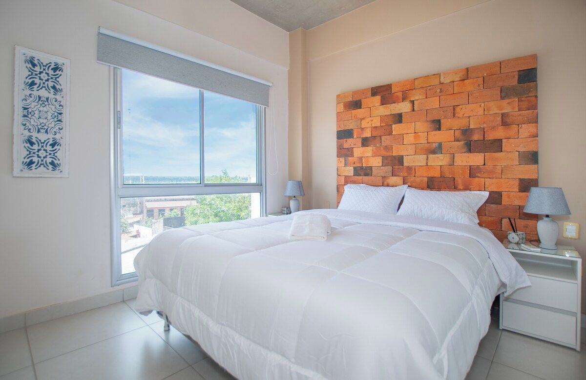 Bright bedroom with river view