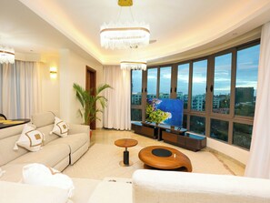 A modern living room with a sofa, coffee table, and a painting on the wall. - Nauras Towers beachfront apartments, Nyali
Infinity pool, gym, sauna, near malls (Mombasa)