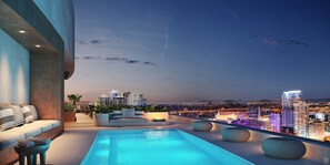 A rooftop pool area with a city view, seating, and a well-lit ambiance. - Modern Luxe Downtown Stay (Miami)