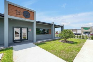A modern building with a sign reading 'THE HUB' and a visible address '3280'. - Magical Family Getaway (Kissimmee)