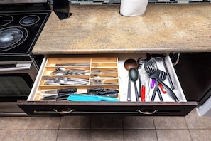 A kitchen drawer with utensils and cookware. - Beautiful 4BR Home. Wellness Room, Games, BBQ Yard (Milton)