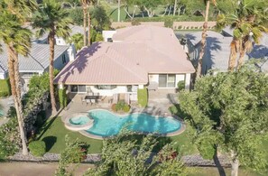 A residential property with a swimming pool, a patio area, and a lawn. - 5 Star Rating Oasis Golf Pool Spa 3BED Pga West (La Quinta)