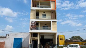 A multi-story building with a ground-level shop and upper residential or commercial spaces.