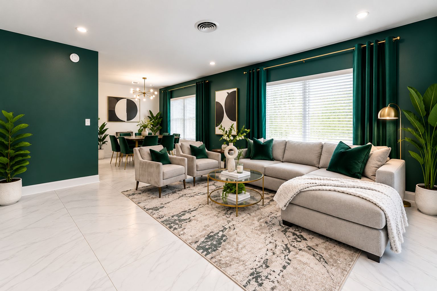 A modern living room with a sofa, armchairs, a coffee table, and a dining area with chairs and a table.