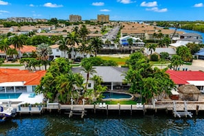 A coastal residential area with a marina, swimming pools, and palm trees. - The Boynton Boat House (Boynton Beach)