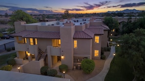 A modern multi-story residential building with a flat roof, multiple windows, and a landscaped front yard. - Scottsdale Getaway | 2BR/2BA | Relax & Unwind (Scottsdale)
