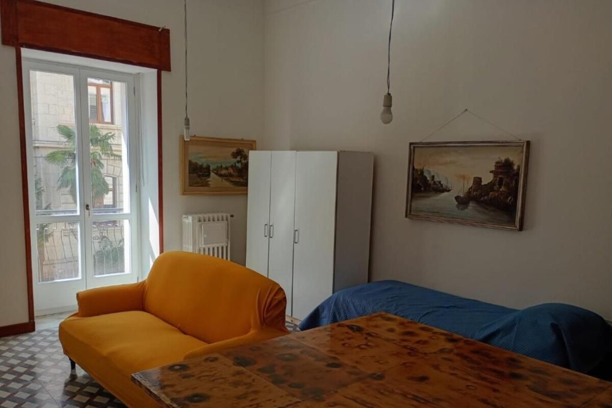 Deluxe Quadruple Room, Balcony, City View | Living area | Computer monitors, printers