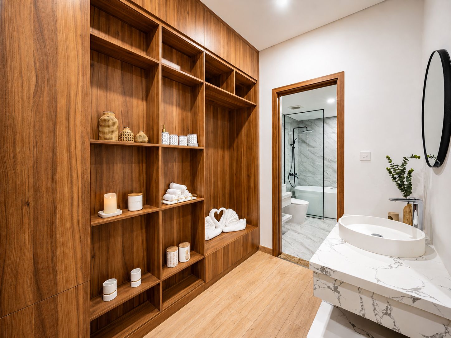 A modern bathroom with wooden shelving, a marble sink, and a glass shower enclosure.