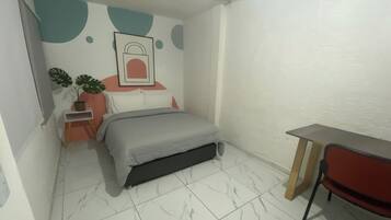 Un dormitorio con una cama, un escritorio y una silla.