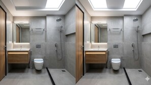 Een moderne badkamer met twee wastafels, een spiegel en een douche.