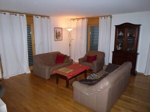 A living room with two sofas, a coffee table, and a cabinet. - Chesa Silvrettina D4 Appartement/Fewo, Dusche oder Bad, WC 4½-Zimmerwohnung by Interhome (Klosters)