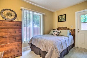 A bedroom with a bed, dresser, and a window with blinds. - 1 Mi to Sand & Surf! 2-Unit Pompano Beach Escape (Pompano Beach)