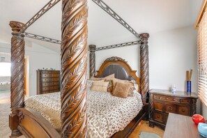 A four-poster bed with a wooden frame and a leopard print bedspread. - Families w/ Pets! Mtn-View Parker Home Near Golf (Parker)
