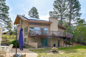 A two-story house with a balcony, a covered patio, and a solar panel on the roof. - Families w/ Pets! Mtn-View Parker Home Near Golf (Parker)