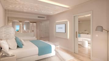 Un dormitorio moderno con una cama grande, mesitas de noche, un espejo y un televisor.