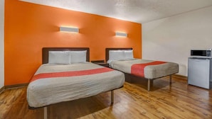 A hotel room with two beds, a microwave, and a small refrigerator. - 2 Queen Beds | Non-Smoking (Clovis NM)