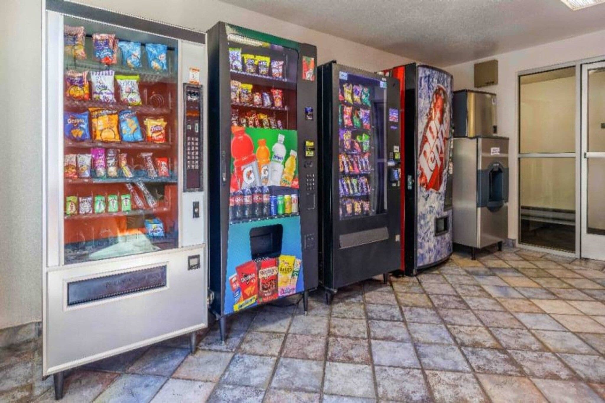 A row of vending machines in a commercial setting.