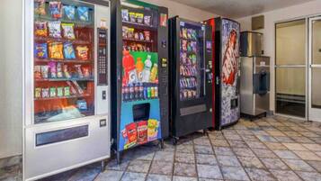 A row of vending machines in a commercial setting.