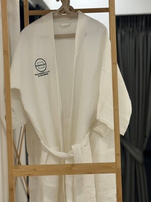 A white bathrobe hanging on a wooden hanger. - Pratumnak 6 Pool Villa Pattaya (Pattaya City)