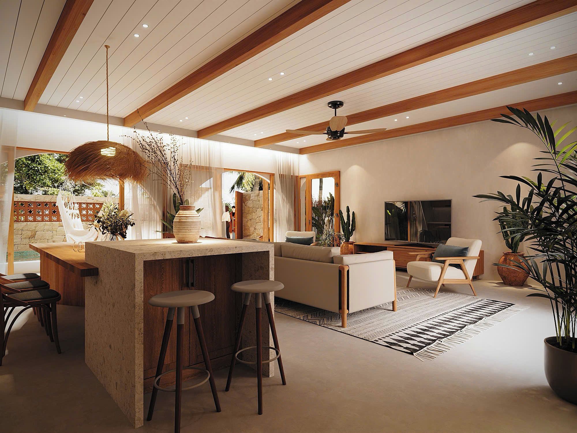 Una cocina moderna con una isla central, taburetes de bar, una zona de comedor con sofá y una sala de estar con televisor.