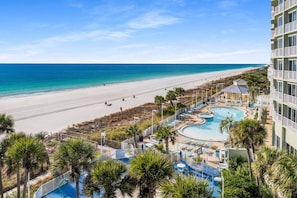 A resort with a pool, beach, and ocean view. - Steps to the Sand! Gulf Front Studio at Boardwalk Resort – Pool, Hot Tubs, Tiki Bar & More! (Panama City Beach)