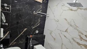 A bathroom with a white sink, a toilet, and a shower. - HOTEL SHREE KARNI PALACE (Sultanpur)