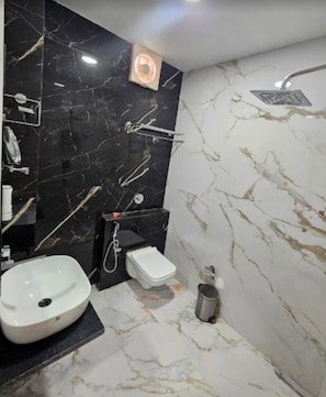 A bathroom with a white sink, a toilet, and a shower. - HOTEL SHREE KARNI PALACE (Sultanpur)
