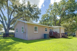 A single-story house with a front porch and a small staircase leading to a covered area. - Walk to Dining: Relax at 609 Gray (Wildwood)