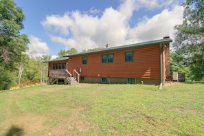 A two-story wooden house with a front deck and a covered outdoor area. - Sibley Shores Lake Cabin w/ Dock & Deck! (Pequot Lakes)