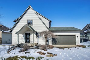 A single-story house with a gabled roof, a front porch, and a garage. - Game Room, Screened Porch! Howard A-frame Chalet (Howard)