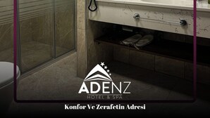 Een haardroger, pantoffels, handdoeken, zeep