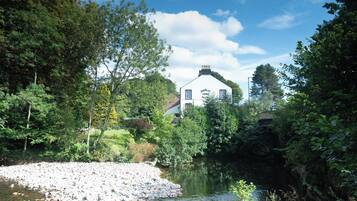 A riverside view with a building labeled 'Stanley Arms Hotel' in the background.
