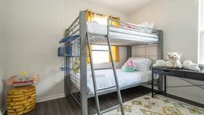 A bunk bed with a ladder, a desk, and a stuffed toy on the desk. - 5BR Tuscan Hills Villa Pool & Themed Rooms (Davenport)