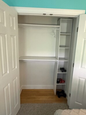 A walk-in closet with open shelves and a shoe rack. - Private Berkshire Retreat 9 Acres, Fenced Yard & Dogs Welcome (Otis)