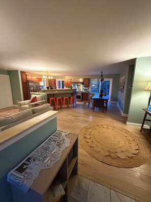A spacious living area with a sofa, a coffee table, and a rug. - Private Berkshire Retreat 9 Acres, Fenced Yard & Dogs Welcome (Otis)