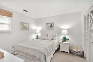 A bedroom with a bed, bedside tables, lamps, and artwork on the walls. - 3 Bedroom- Seascape Golf and Beach Resort (Miramar Beach)