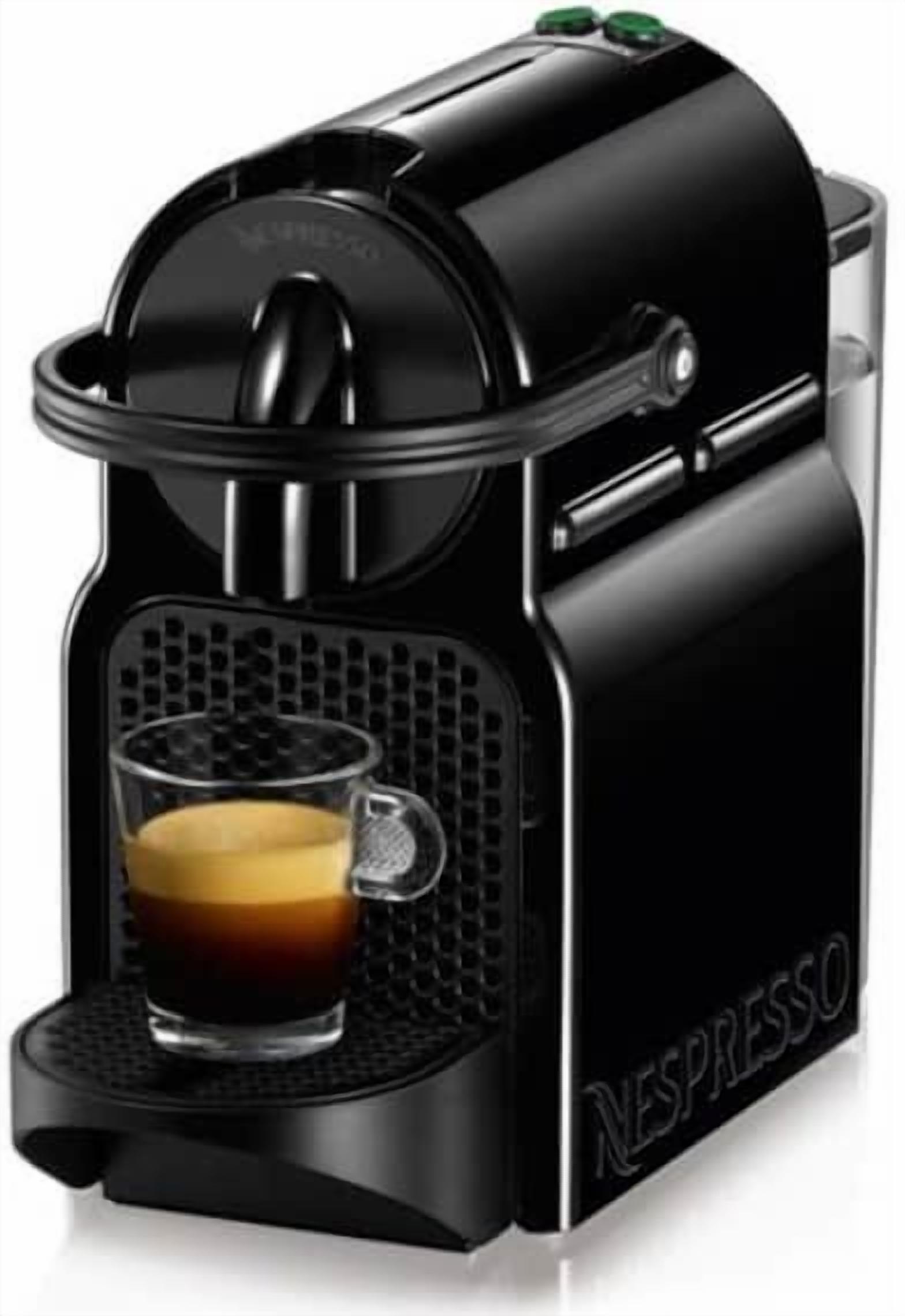 A Nespresso coffee machine with a glass cup of coffee.