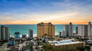 A high-rise hotel with a view of the ocean at sunset. - Anderson 1103 - Oceanfront 2BR Condo (Myrtle Beach)