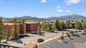 A parking lot with a view of a lake and mountains in the distance. - New 3BR Condo Within Walking Distance to Marina and Mins From Ski Resorts! (Dillon)