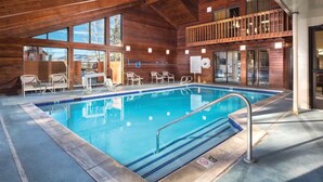An indoor swimming pool with clear blue water, surrounded by wooden walls and a balcony with railings. - Rare find- Spacious 2 bdrm condo during President's Day in Steamboat Springs (Steamboat Springs)