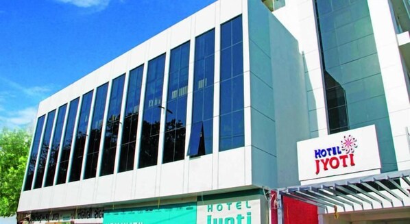 A modern hotel building with a sign reading 'HOTEL JYOTI'. - OYO Rooms Kanak Road (Rajkot)