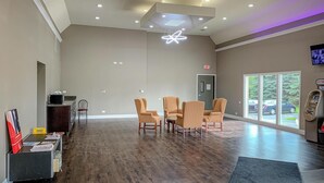 A spacious lobby with a reception desk, seating area, and an ATM. - Travel Inn Rockford (Rockford)