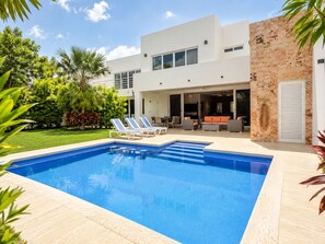 A modern house with a swimming pool, outdoor seating, and a well-maintained garden. - Jounieh House | Unique, Spacious Home with Private Pool (Cozumel)