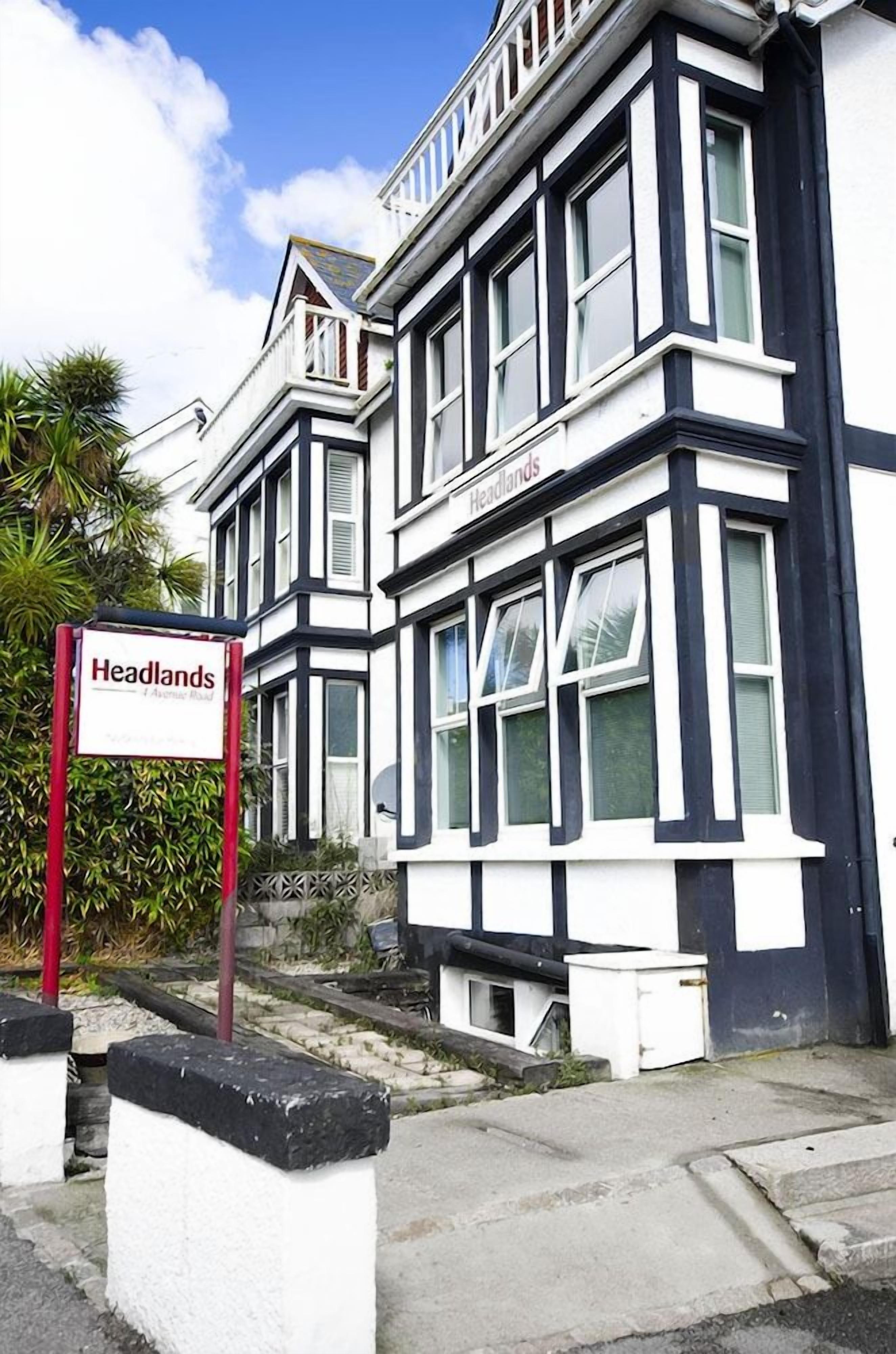A building with a sign reading 'Headlands.'