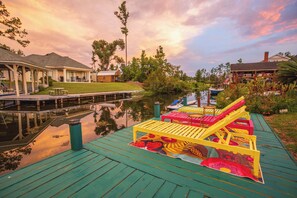 A waterfront property with a dock, lounge chairs, and a boat. - 3 Bedroom/2 Bathroom Lake Park Long Pond Oasis (Lake Park)