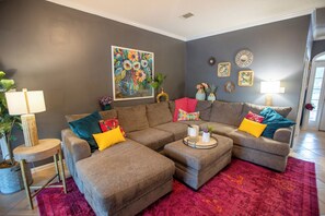 A living room with two sofas, a coffee table, a lamp, and a painting on the wall. - 3 Bedroom/2 Bathroom Lake Park Long Pond Oasis (Lake Park)
