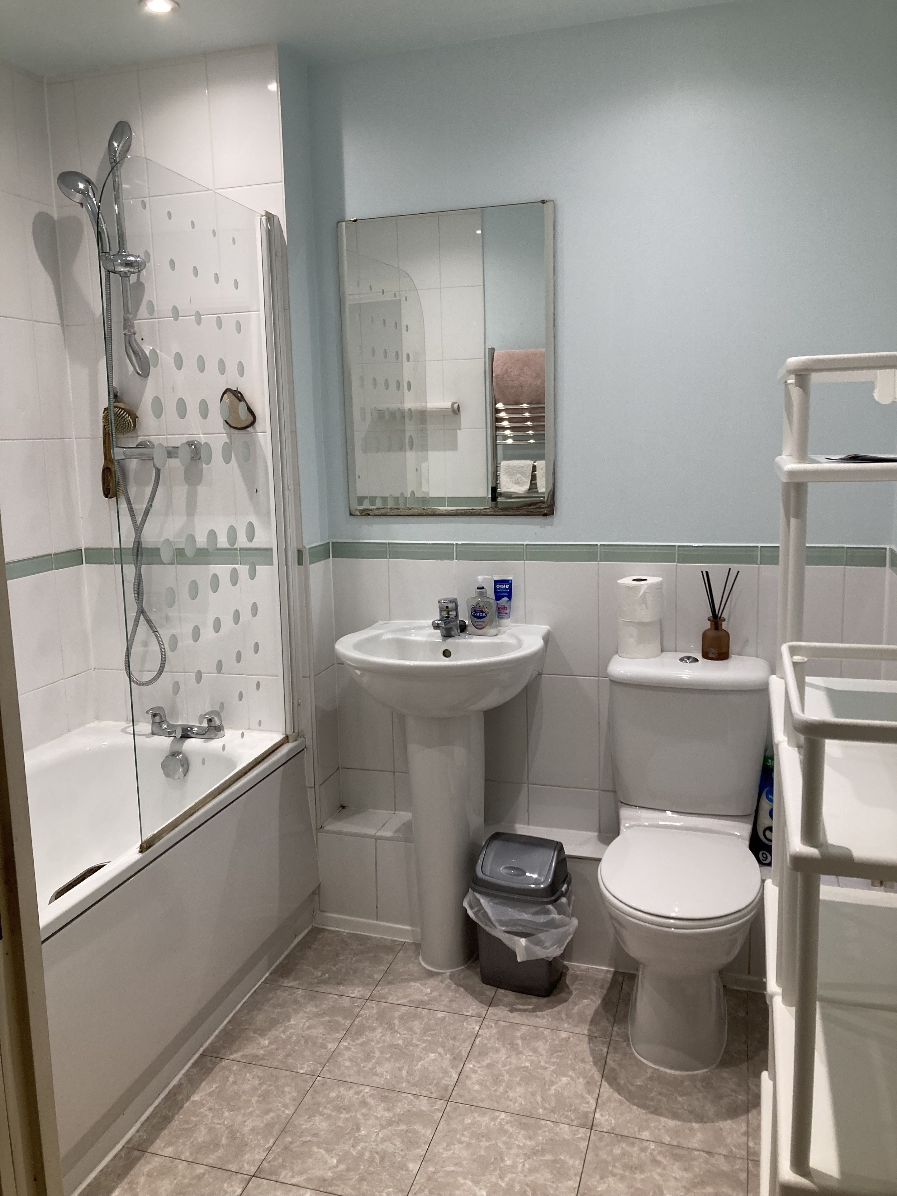 A bathroom with a bathtub, a sink, a toilet, and a shower.