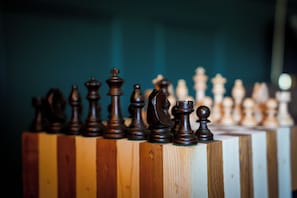 A chessboard with pieces arranged in a game setting.